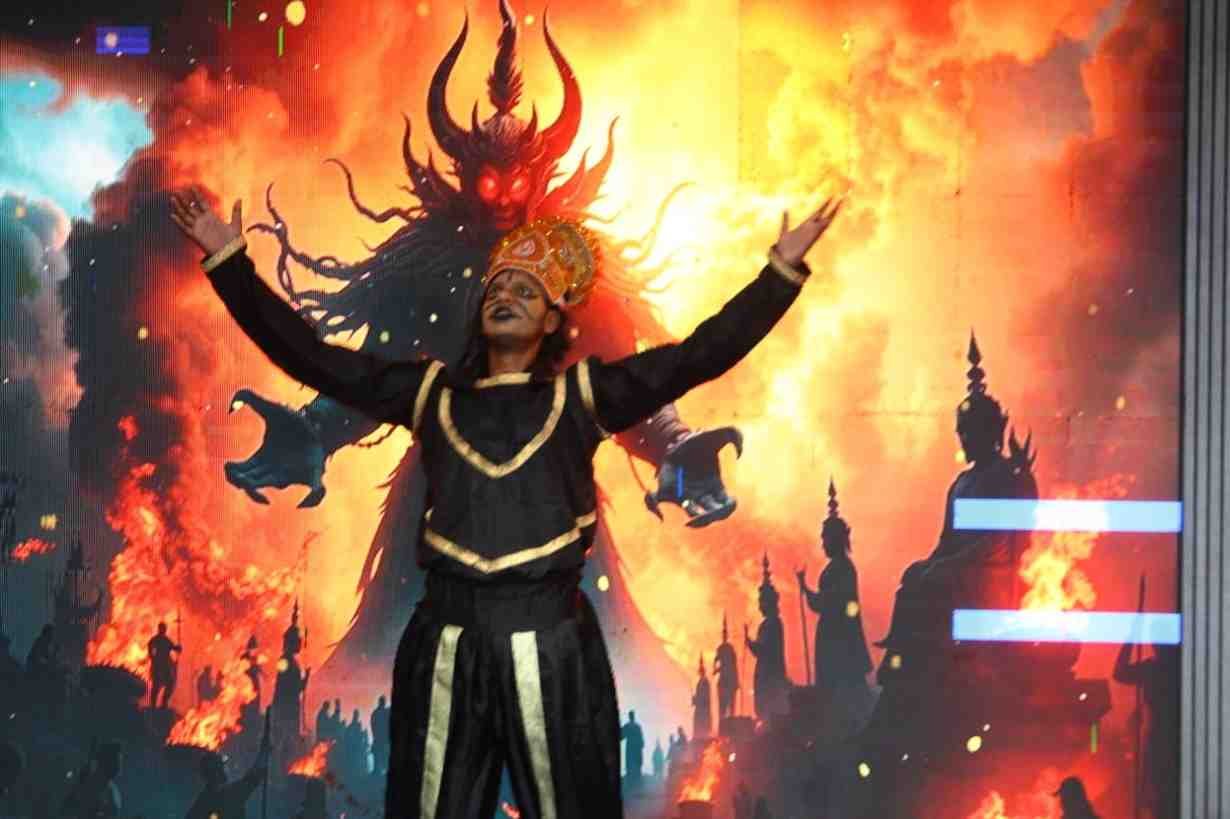 A student performing on stage in costume