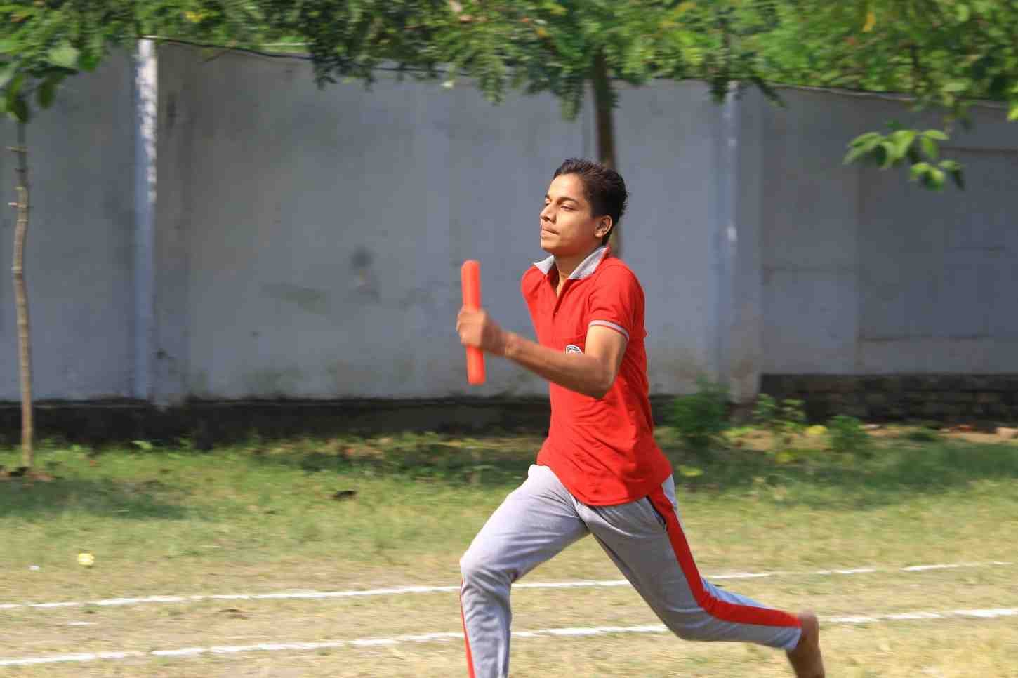 A student sprinting on the school ground